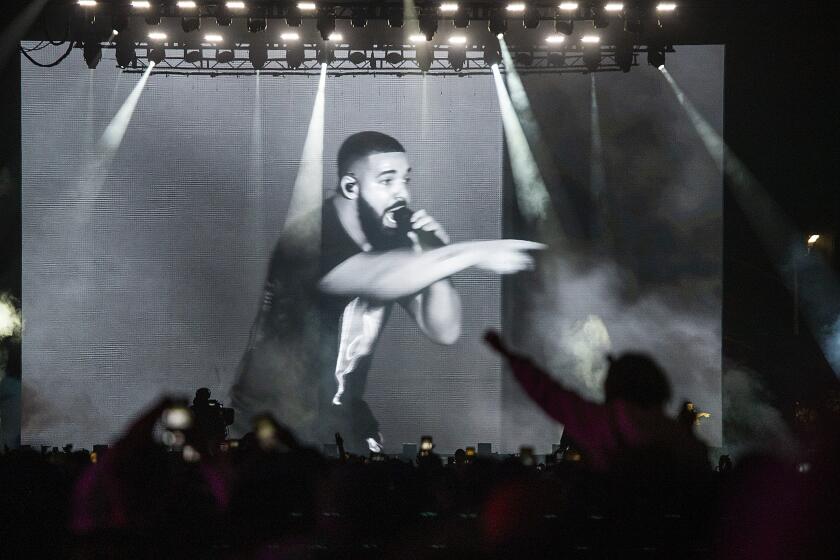 LOS ANGELES, CALIF. -- SUNDAY, NOVEMBER 10, 2019: Drake is seen performing on a large television screen as he performs as one of three mystery guests of Tyler The Creator on the final day of Camp Flog Gnaw Carnival at Dodger Stadium parking lot in Los Angeles, Calif., on Nov. 10, 2019. (Allen J. Schaben / Los Angeles Times)