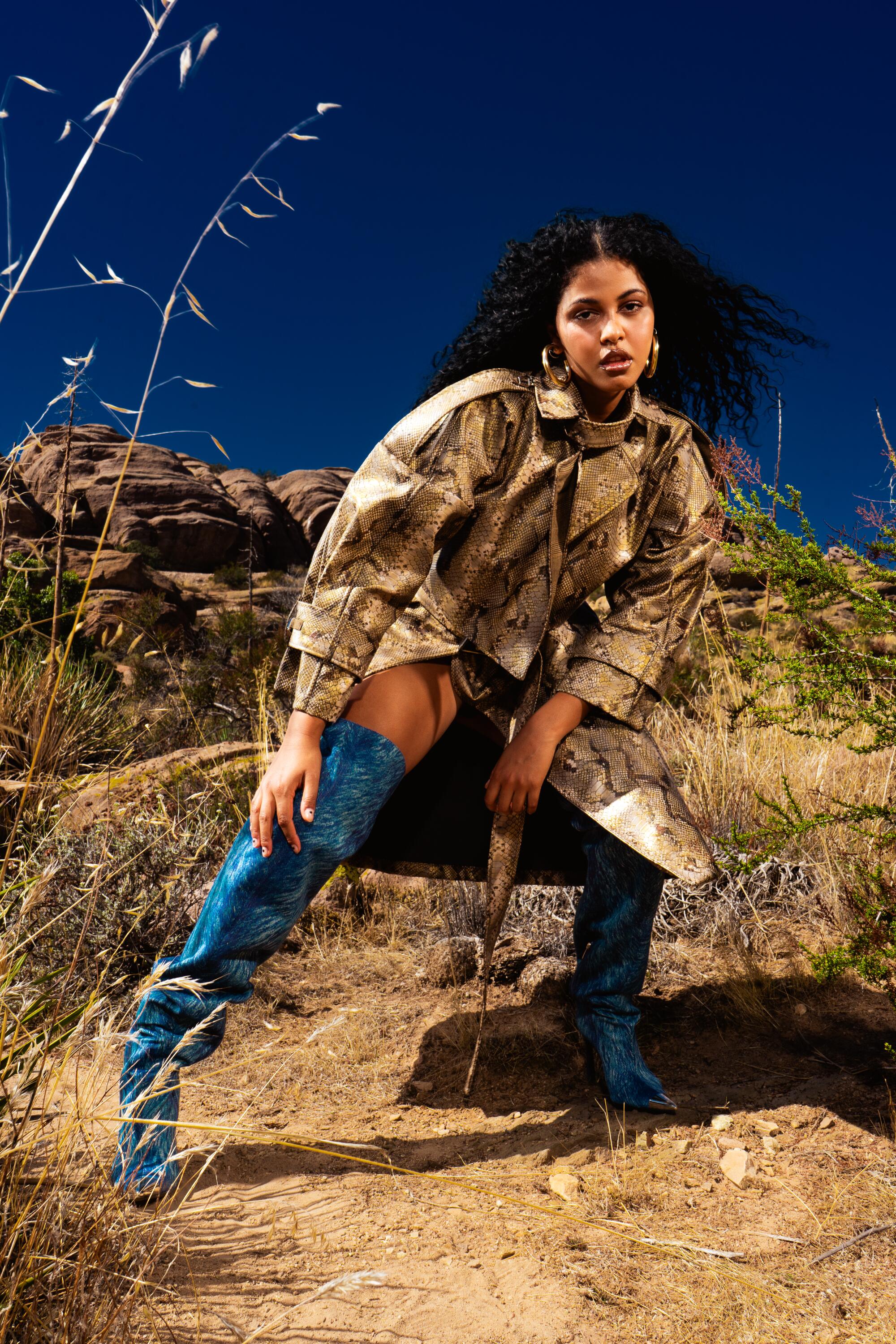 Artist Yendry poses in the desert.