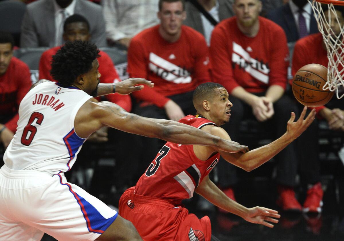 Portland Trail Blazers' C. J. McCollum, right, is fouled by Clippers' DeAndre Jordan in the first half of Game 5 of the NBA Western Conference first round playoff game on Wednesday.