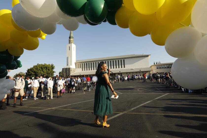 Los Angeles, California-Sept. 6, 2022-St. Eugene Catholic school Principal Celynda Kingsby welcomes students, teachers, administrators and parents back to school on Sept. 6, 2022. The school went through a full renovation recently. The Catholic school enjoyed an enrollment growth as Catholic School enrollment increased by 4% during the 2021-22 school year, marking the Archdiocese of Los Angeles' first enrollment increase since 1988. (Carolyn Cole / Los Angeles Times)