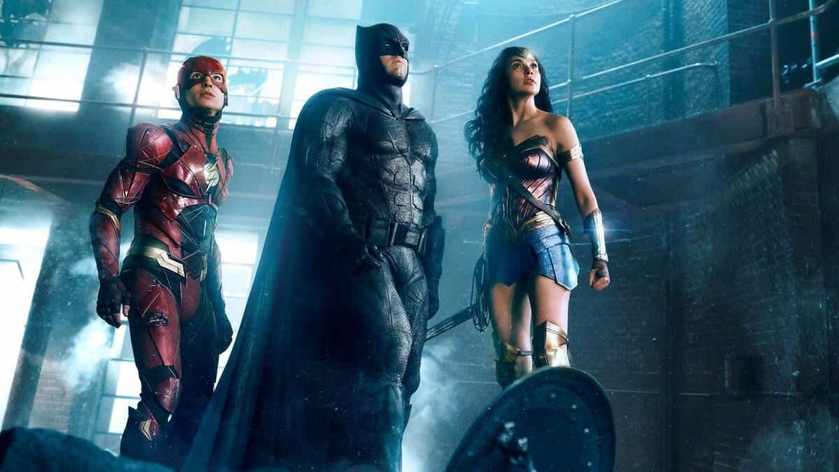 The Flash, Batman and Wonder Woman gazing up