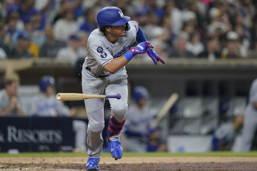 Los Angeles Dodgers' Miguel Vargas watches his two-run single during the sixth inning of the team's baseball game against the San Diego Padres, Thursday, Sept. 29, 2022, in San Diego. (AP Photo/Gregory Bull)