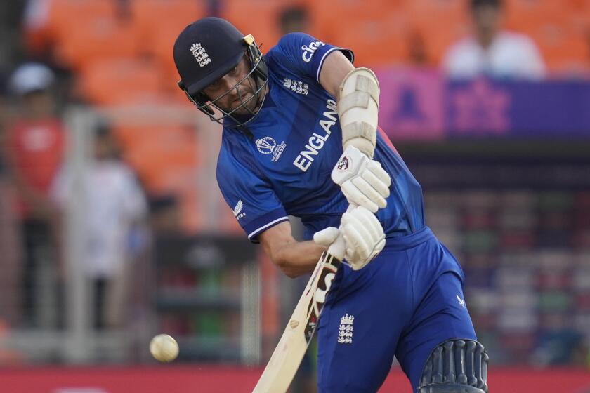 England's Mark Wood bats during the ICC Cricket World Cup opening match between England.