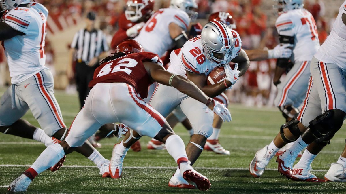 Ohio State running back Antonio Williams (26) runs past Indiana's Marcelino Ball (42) for a 5-yard touchdown during the second half on Thursday.