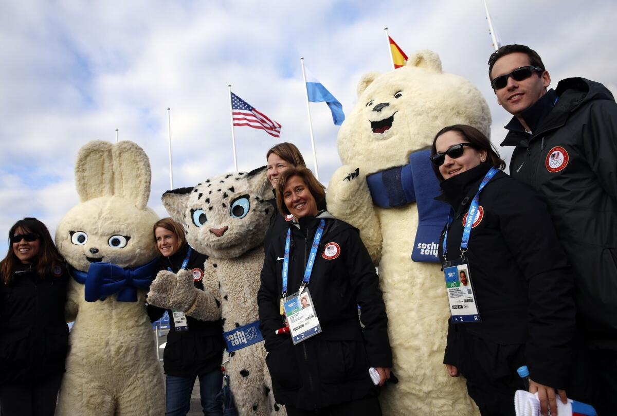 U.S. team officials and mascots Polar Bear, Leopard and Hare during the team's welcome ceremony Thursday in Sochi before the start of the 2014 Winter Olympic Games.