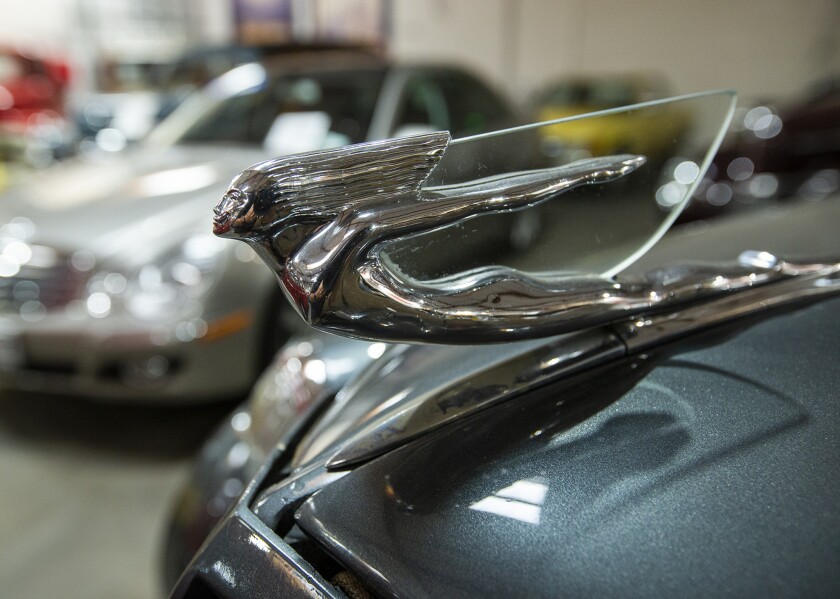 The hood ornament for a 1937 Cadillac 7057 at Crevier Classic Cars in Costa Mesa.