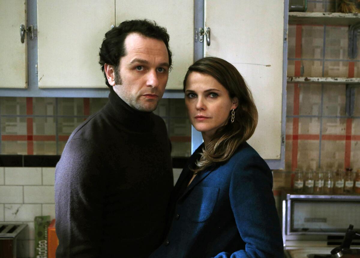 Matthew Rhys and Keri Russell appear in a scene from "The Americans."