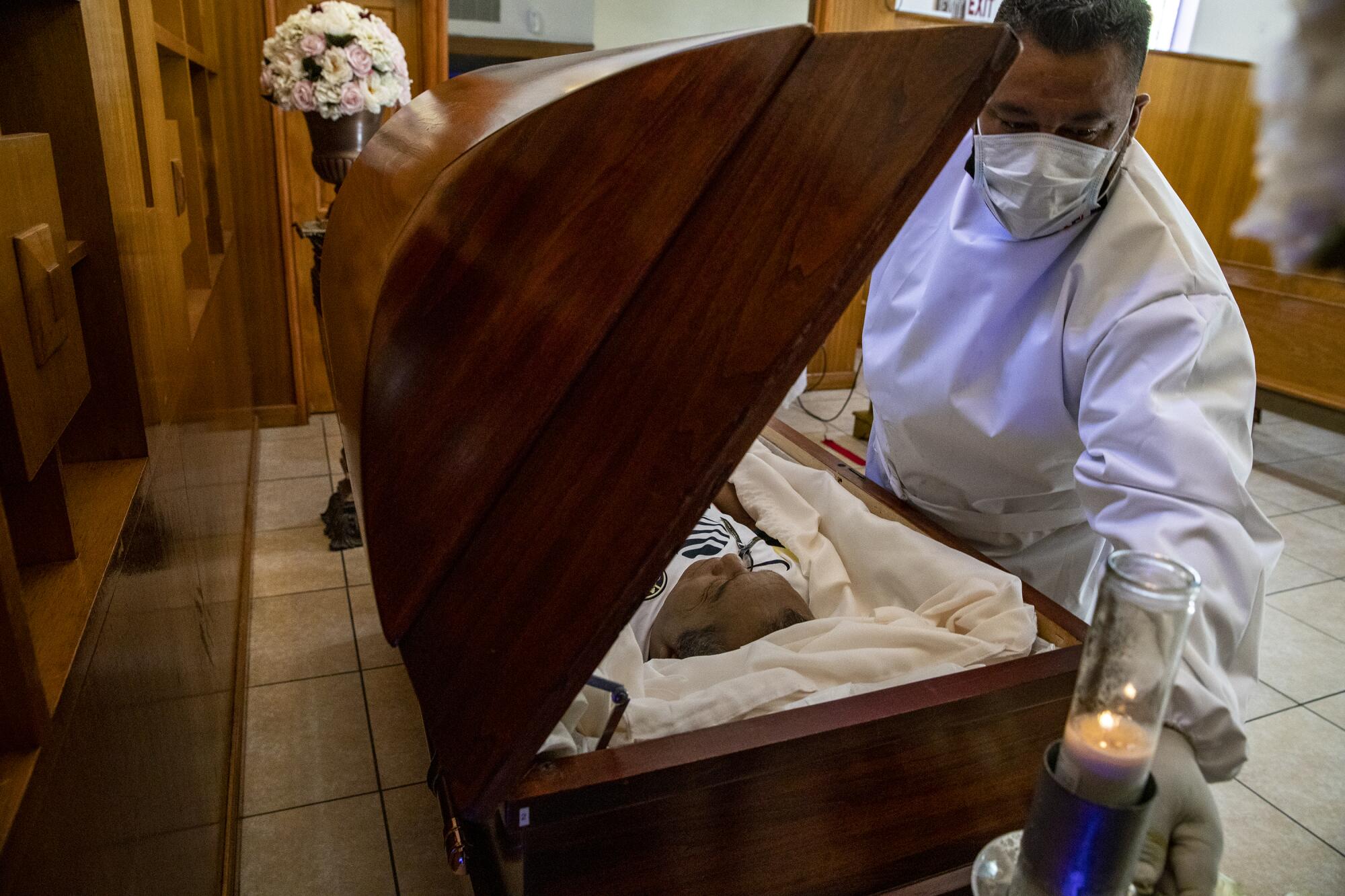 Continental Funeral Home attendant Miguel Peralta