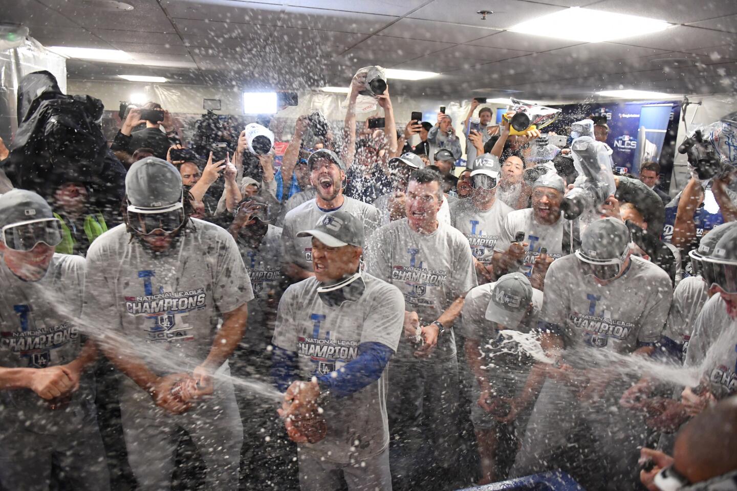 Dodgers celebrate in the locker room after winning game seven of the National League Championship Series.
