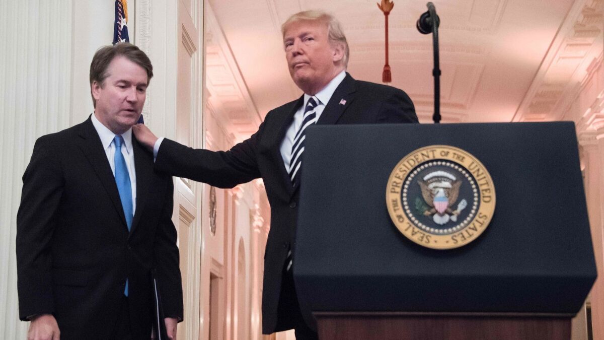 President Trump and Supreme Court Justice Brett Kavanaugh at a ceremonial swearing-in event at the White House on Monday.