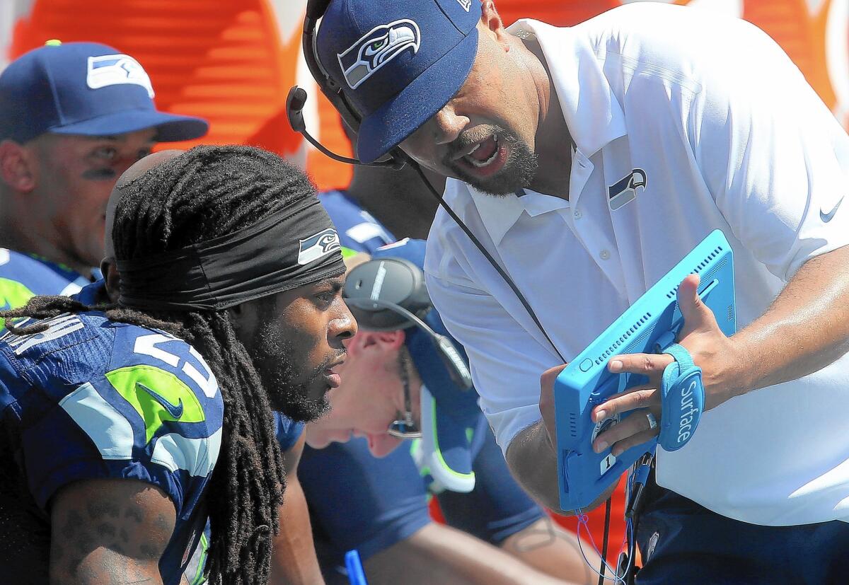 Microsoft's Surface tablets are used on NFL sidelines, including the bench of the Seattle Seahawks, who played the Chargers at Qualcomm Stadium in San Diego on Sunday.