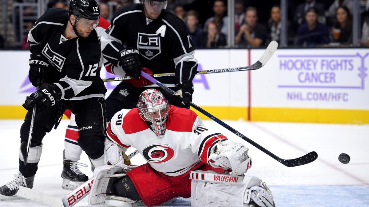 Kings right wing Marian Gaborik, left, and center Anze Kopitar (11) watch a shot get past Hurricane goalie Cam Ward in the second period Friday night at Staples Center.