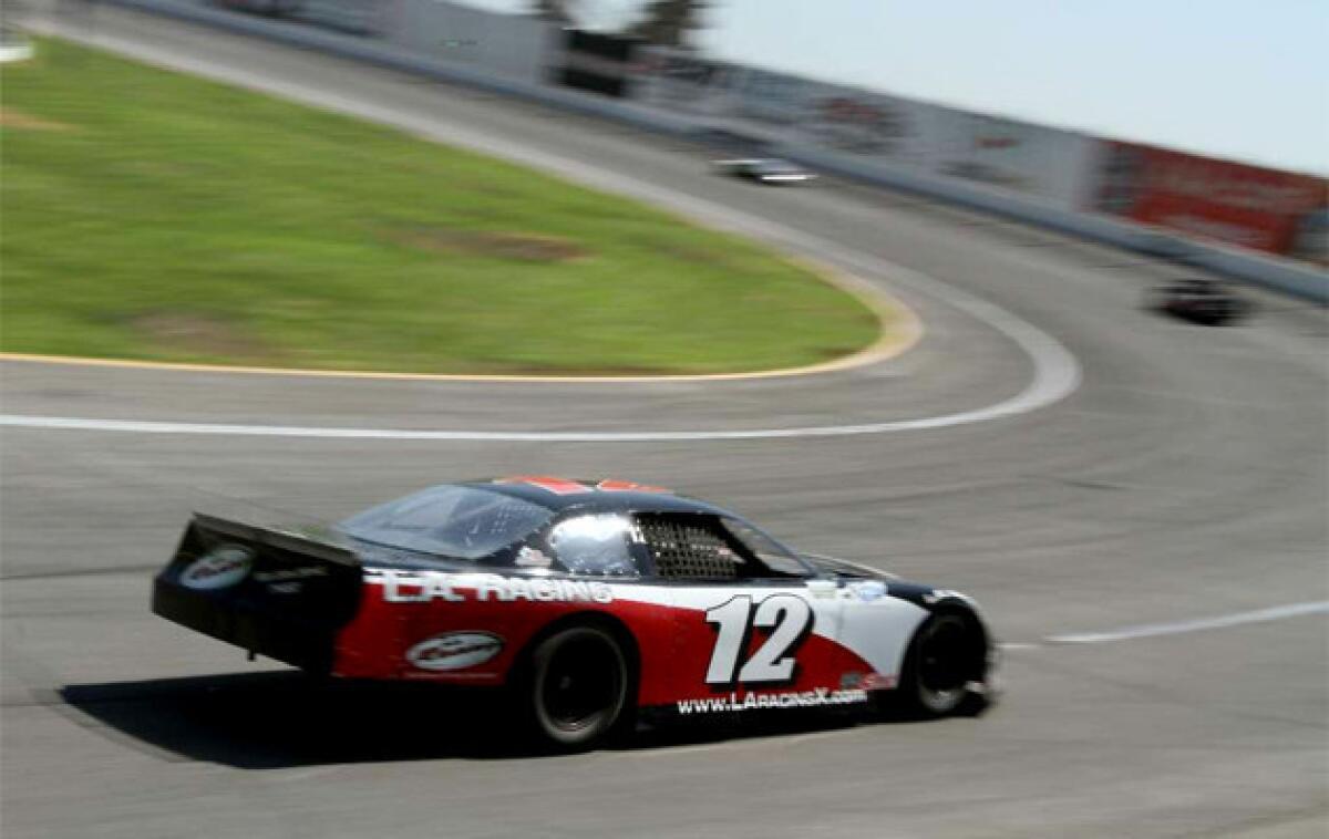 Times columnist Chris Erskine experiences a stock racing car at race driving school at Irwindale Speedway.