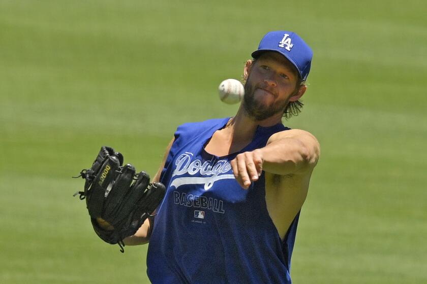 Los Angeles Dodgers starting pitcher Clayton Kershaw warms up during the restart of baseball spring training Saturday, July 4, 2020, in Los Angeles. (AP Photo/Mark J. Terrill)