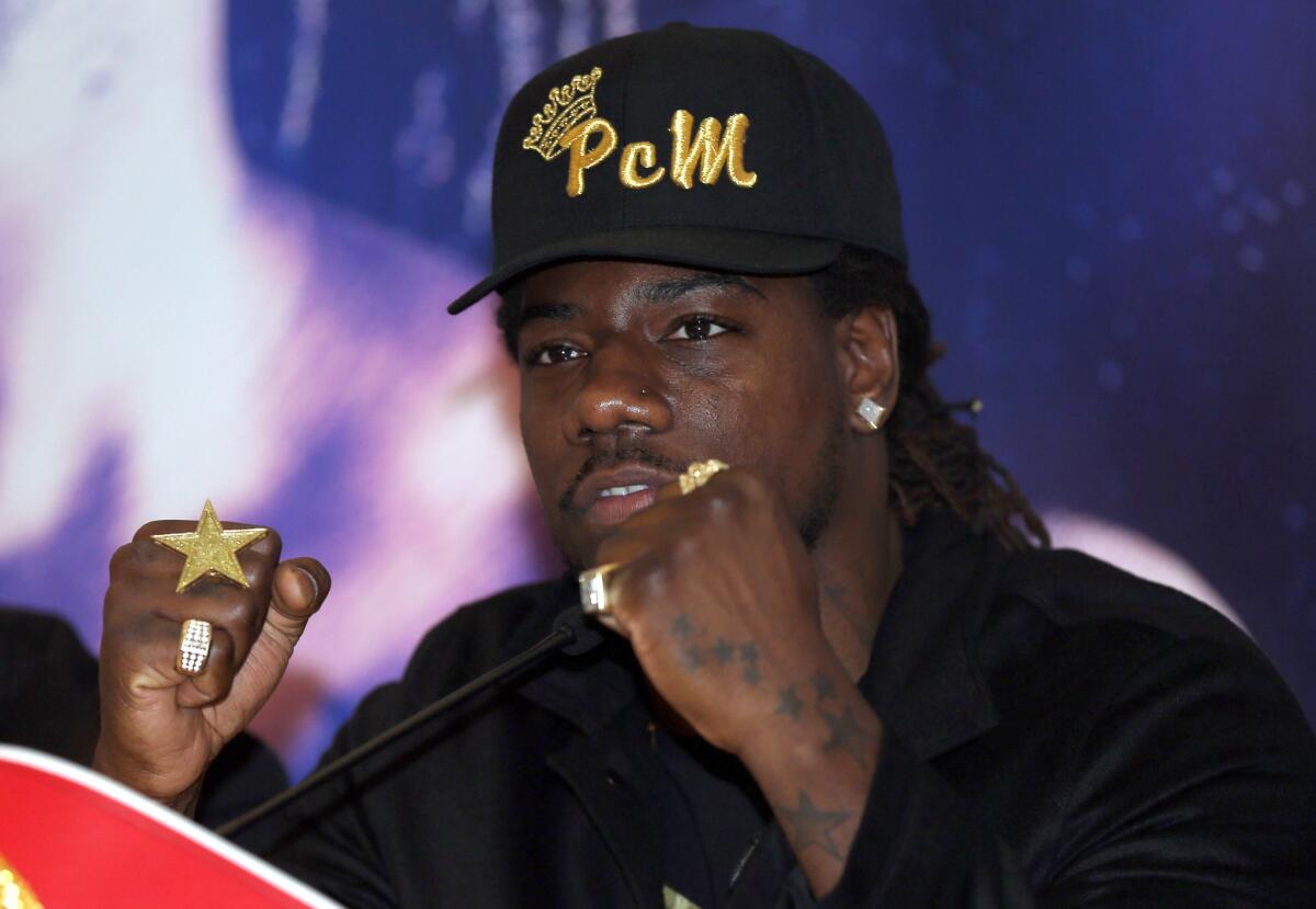 Heavyweight boxer Charles Martin raises his fists during a London news conference on Feb. 19.