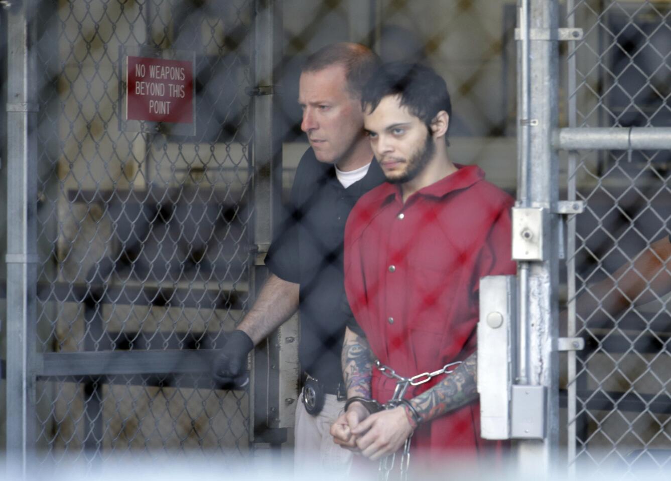 Esteban Santiago leaves the Broward County jail for a hearing in federal court, Tuesday, Jan. 17, 2017, in Fort Lauderdale, Fla. Santiago has been charged with committing violence against people at an international airport resulting in death and two firearms offenses, following a shooting at the Fort Lauderdale-Hollywood International Airport Jan. 6. (AP Photo/Lynne Sladky)