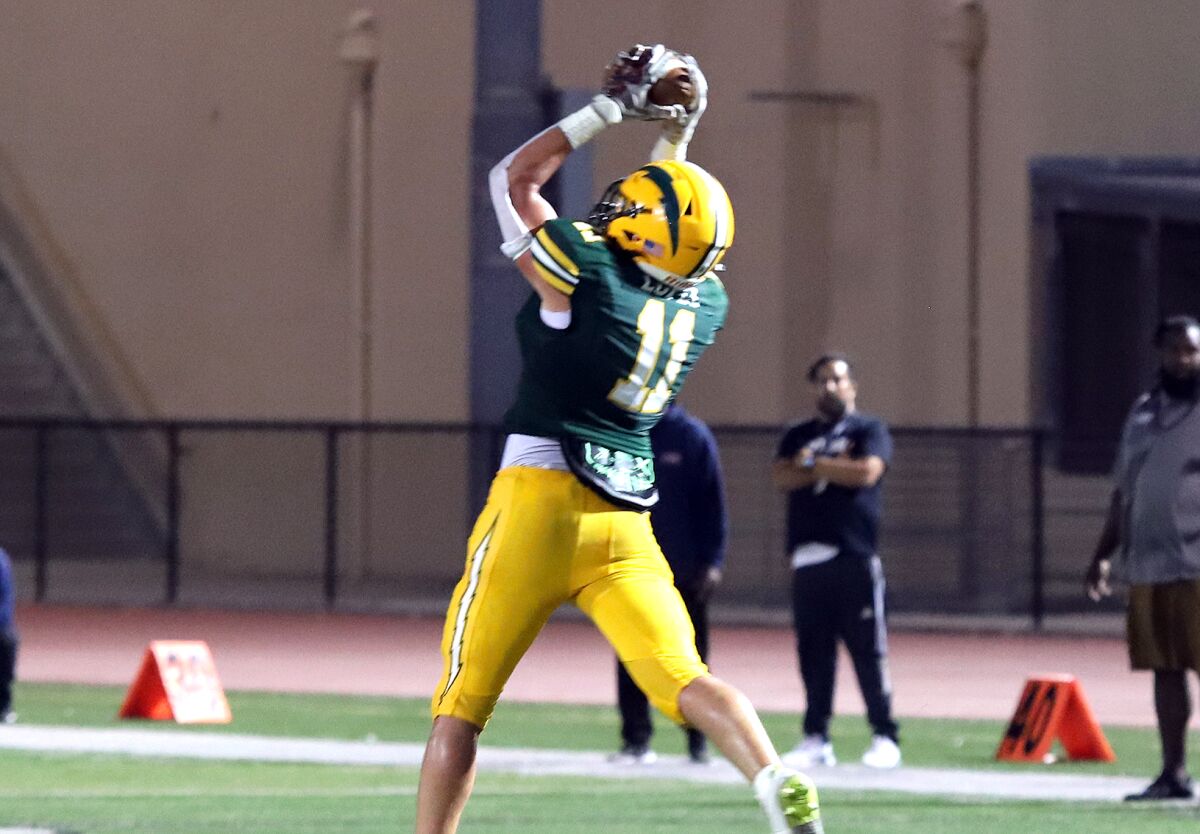 Edison's Dominic Lopez (11) makes an interception against Leuzinger on Aug. 26.
