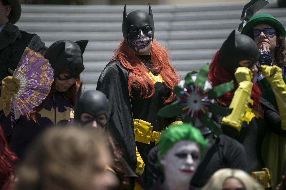 DC world cosplayers gather for a photo shoot on the last day of Comic-Con 2016 at the San Diego Convention Center.