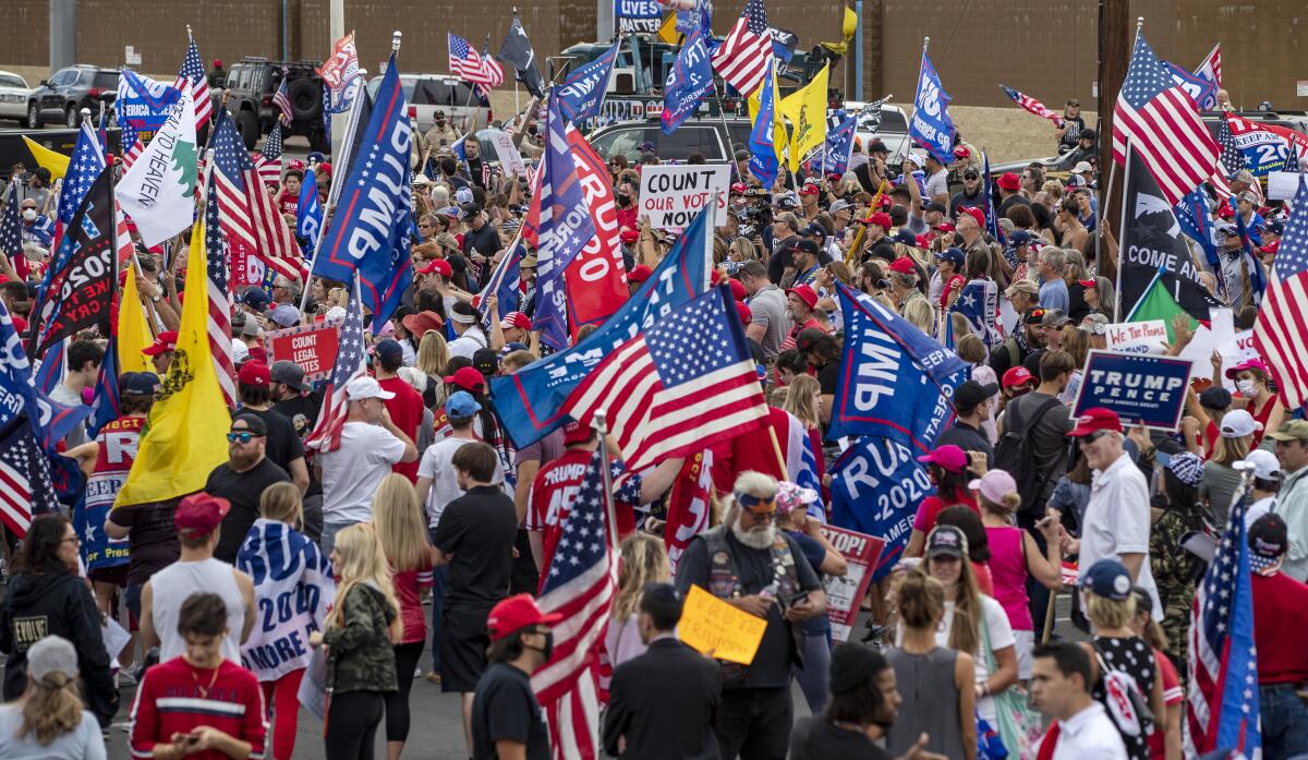 A crowd of about 1,000 Trump supporters gather outside the Maricopa county elections building Friday to protest the results