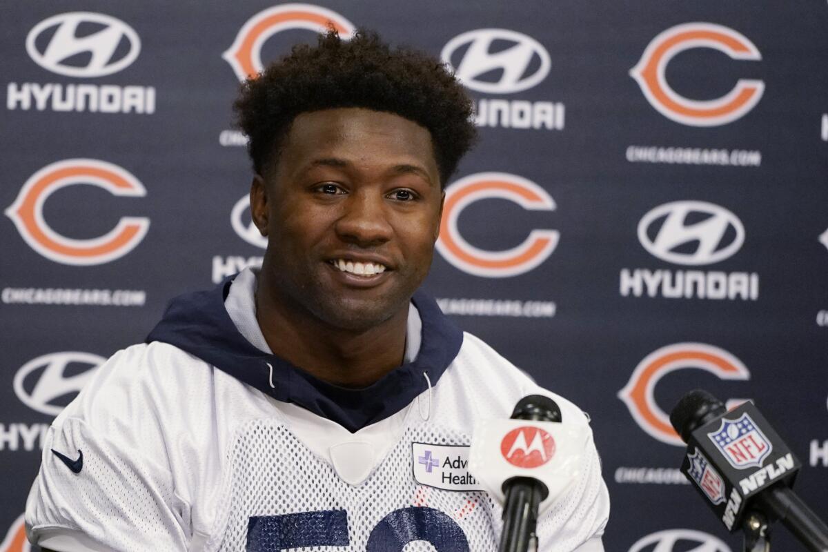 FILE - Chicago Bears linebacker Roquan Smith speaks at a news conference in Lake Firest, Ill., April 20, 2022. Smith is requesting a trade, saying the team has not negotiated in good faith for a contract extension. Smith, who does not have an agent, wrote Tuesday, Aug. 9, 2022 in a statement to NFL.com he has “officially” asked to be dealt and that it was “deeply painful.” He said he has been trying to negotiate an extension since April and accused the organization of trying to take advantage of him. (AP Photo/Nam Y. Huh)