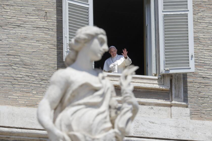 Pope Francis delivers his blessing from the window of his studio overlooking St. Peter's Square, at the Vatican, Sunday, May 24, 2020. For the first time in months, well-spaced faithful gathered in St. Peter’s Square for the traditional Sunday papal blessing, casting their gaze at the window where the pope normally addresses the faithful, since the square had been closed due to anti-coronavirus lockdown measures. (AP Photo/Andrew Medichini)