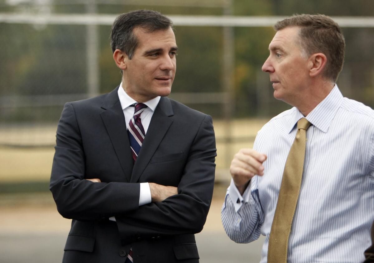 Los Angeles Unified School District Superintendent John Deasy, right, with Mayor Eric Garcetti. The school chief, who took the helm in 2011, recently made waves when he told some top school officials that he might step down.