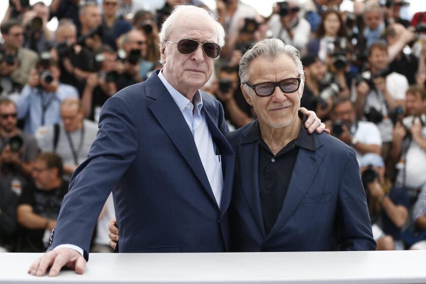 Sir Michael Caine, left and Harvey Keitel pose during the photocall for "Youth" at the 68th Cannes Film Festival.