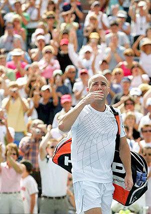 Andre Agassi blows kisses to the U.S. Open crowd Sunday after his career came to a close with a four-set loss to Benjamin Becker of Germany.