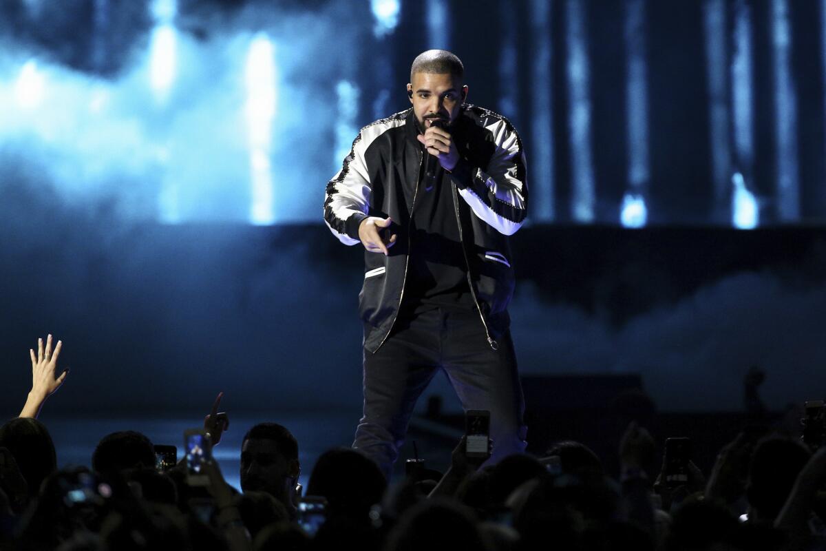 Drake performs at the 2016 iHeartRadio Music Festival in Las Vegas on Sept. 23. Drake earned a record-breaking 13 American Music Awards nominations on Monday.