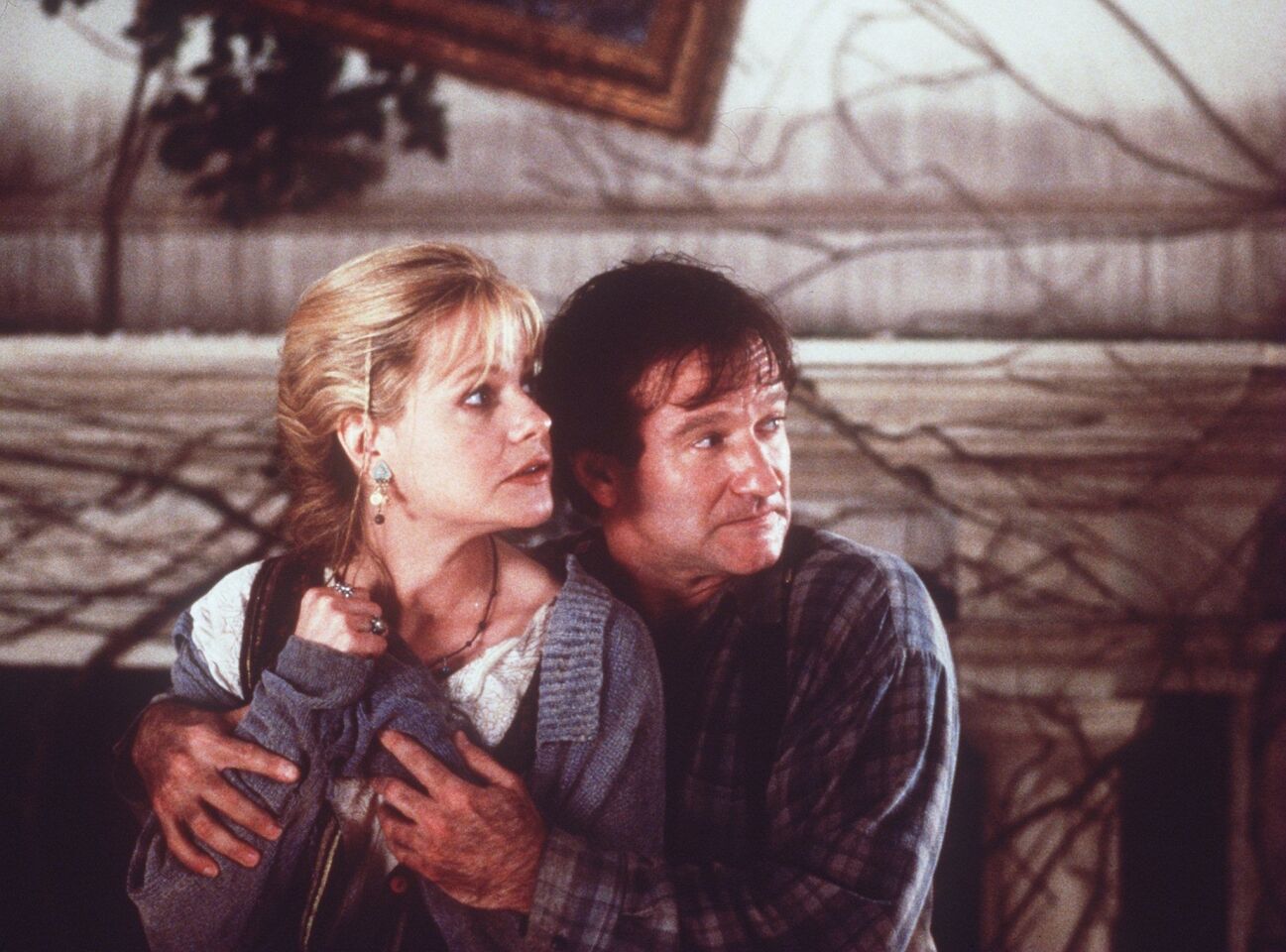 Robin Williams plays Alan Parrish, a man who was trapped in a board game for 26 years in 1995's "Jumanji." He costarred with Bonnie Hunt.