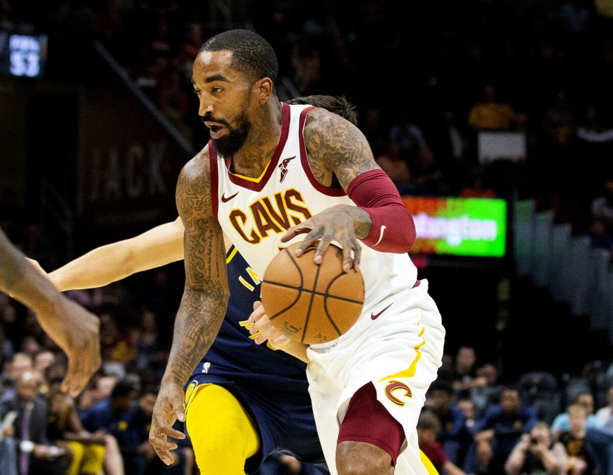 FILE - In this Oct. 8, 2018, file photo, Cleveland Cavaliers guard J.R. Smith dribbles to the basket during the first quarter of a preseason NBA basketball game against the Indiana Pacers in Cleveland. J.R. Smith has joined LeBron James and the Los Angeles Lakers for their championship push. The Lakers announced their long-anticipated signing of Smith as a substitute player on Wednesday, July 1, 2020, the first day allowed under the rules of the NBA's summer restart. (AP Photo/Scott R. Galvin, File)