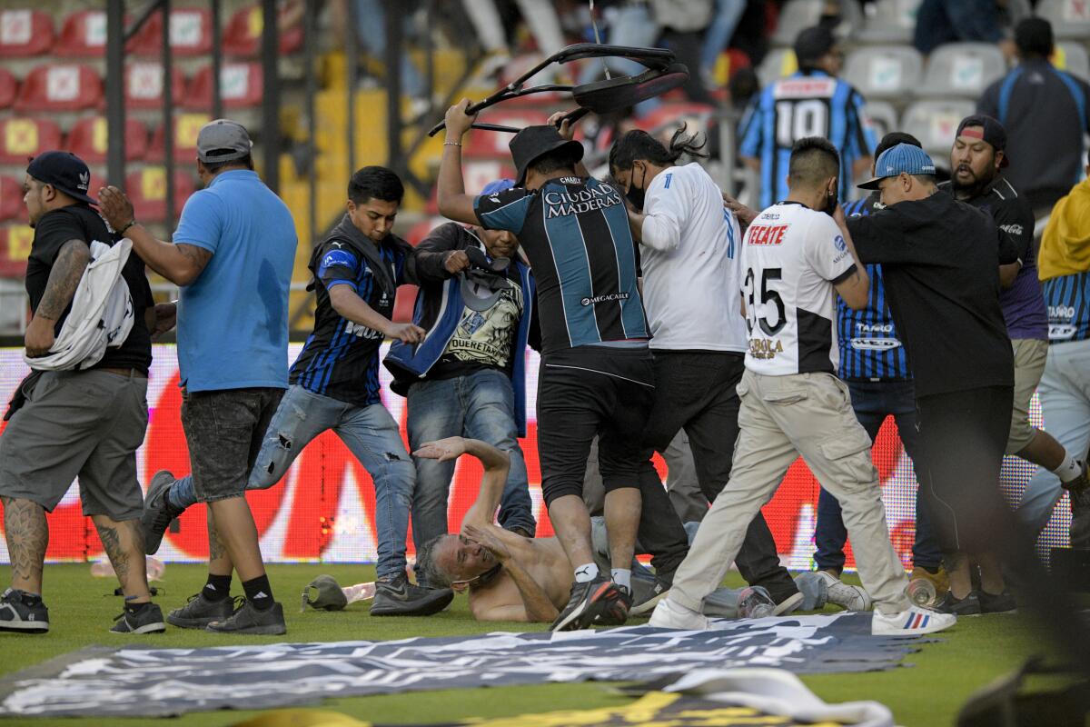 Mexican soccer game brawl: At least 26 injured as fights break out at Liga MX game between Querétaro and Atlas fans