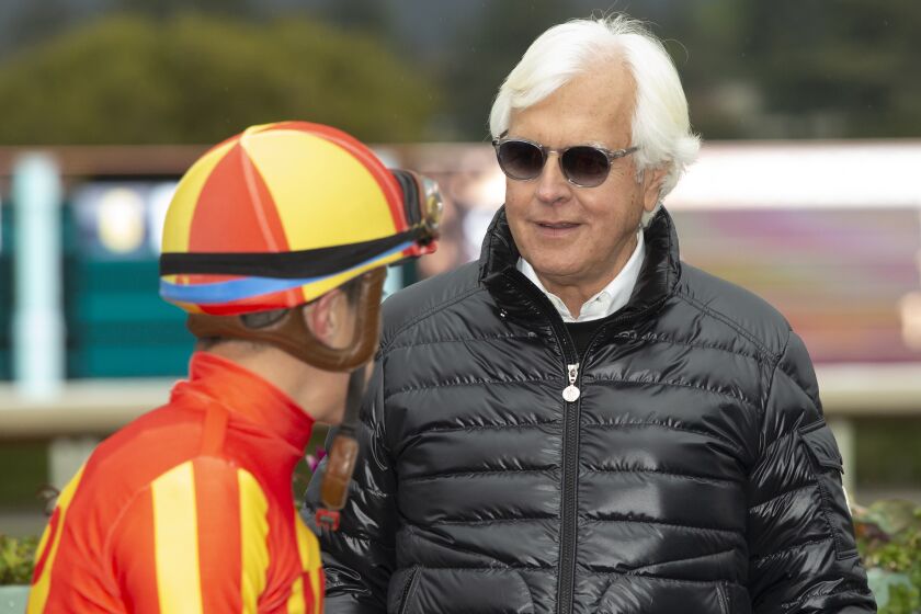 In this image provided by Benoit Photo, Havnameltdown's trainer Bob Baffert, right, and jockey Juan Hernandez, left, react after their victory in the Grade II $200,000 San Vicente Stakes horse race Sunday, Jan. 29, 2023, at Santa Anita Park in Arcadia, Calif. (Benoit Photo via AP)