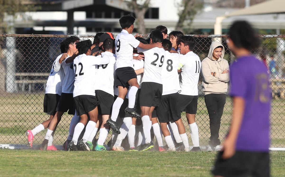 Los Amigos celebrates a goal by midfielder Izaiah Franco during a Garden Grove League soccer game at Santiago on Friday.