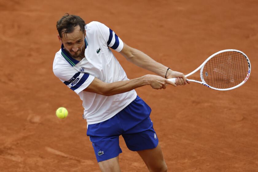 Russia's Daniil Medvedev plays a shot against Serbia's Miomir Kecmanovic during their second round match of the French Open tennis tournament at the Roland Garros stadium in Paris, Thursday, May 30, 2024. (AP Photo/Aurelien Morissard)