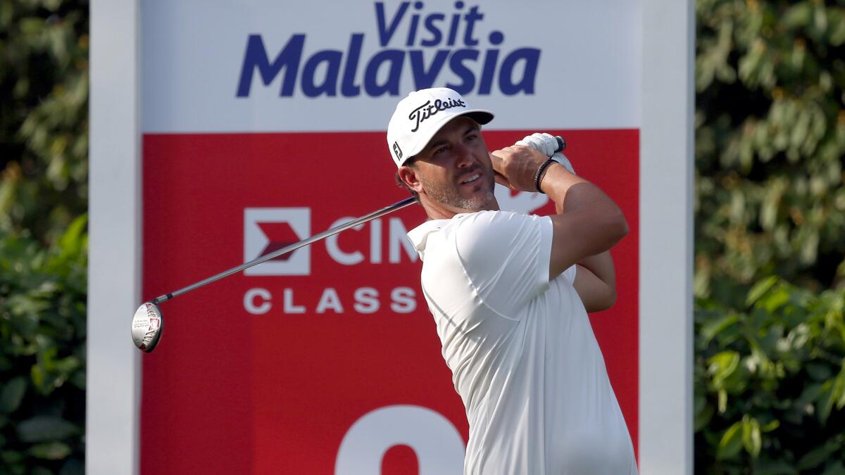 Scott Piercy watches his tee shot at No. 2 during the first round of the CIMB Classic on Thursday.