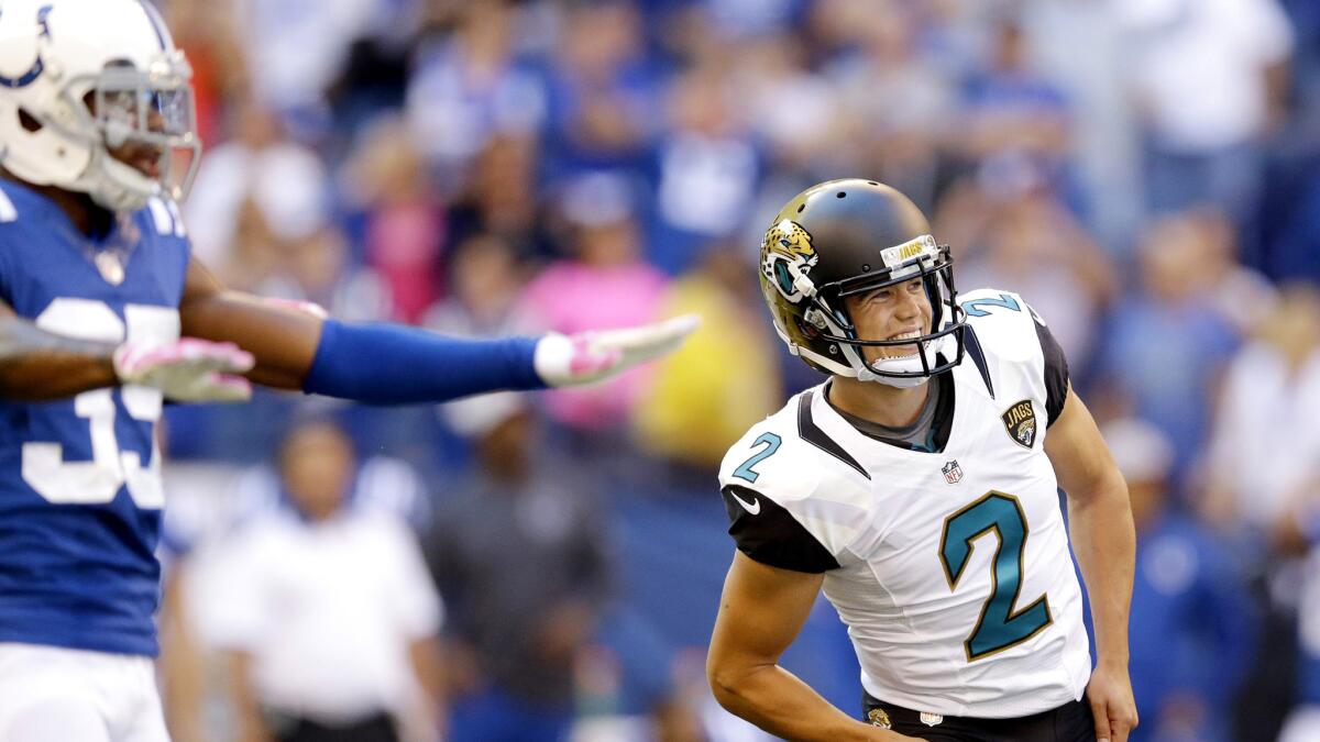 Jaguars kicker Jason Myers (2) and Colts defender Josh Thomas reacts as a potential game-winning field goal sails wide right Sunday.