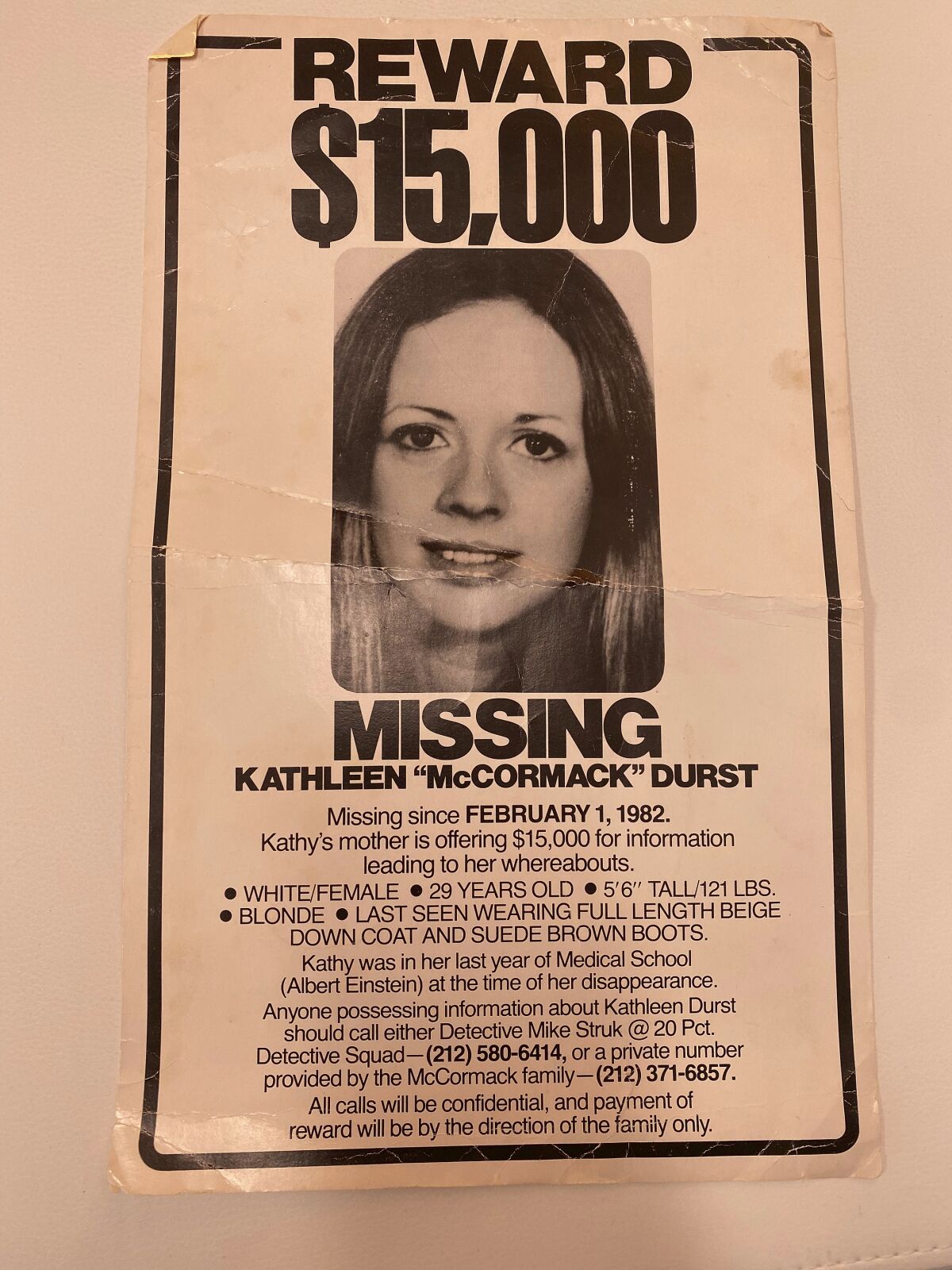 This Thursday, Jan. 14, 2022, photo released by Jim McCormack shows a vintage reward poster for Kathleen "McCormack" Durst, missing since February 1, 1982. Kathy's mother offered $15,000 at the time, for information about her whereabouts. A quest for the fortune left behind by Robert Durst is underway just days after his death. A lawyer for the family of his missing first wife notified the real estate tycoon’s trust Tuesday, Jan. 11, 2022 that it would be seeking more than $100 million from Durst’s estate and widow. (Jim McCormack via AP)