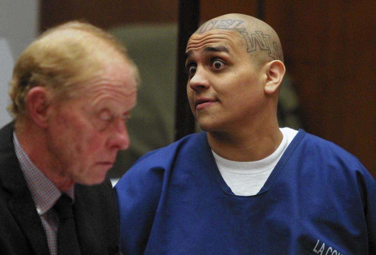 Jose Contreras Zapien Jr. looks past his attorney Patrick Lake, left, as he listens to statements by family members of Eddie Lopez, 15, whom Zapien murdered in 2006.