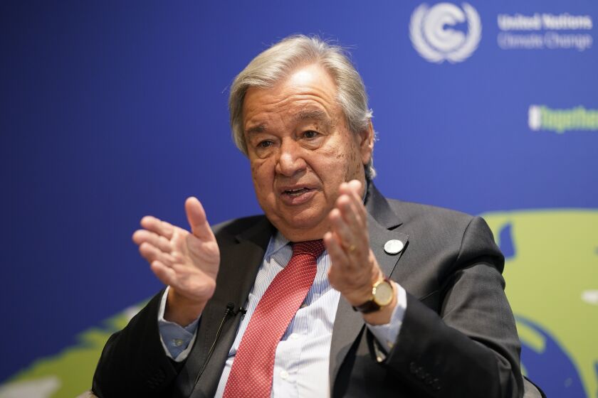 UN Secretary-General Antonio Guterres gestures during an interview at the COP26 U.N. Climate Summit in Glasgow, Scotland, Thursday, Nov. 11, 2021. Guterres says the Paris temperature goal of limiting warming to 1.5 degrees "is on life support" with climate talks so far not reaching any of the U.N.'s three goals, however "until the last moment hope should be maintained." (AP Photo/Alberto Pezzali)