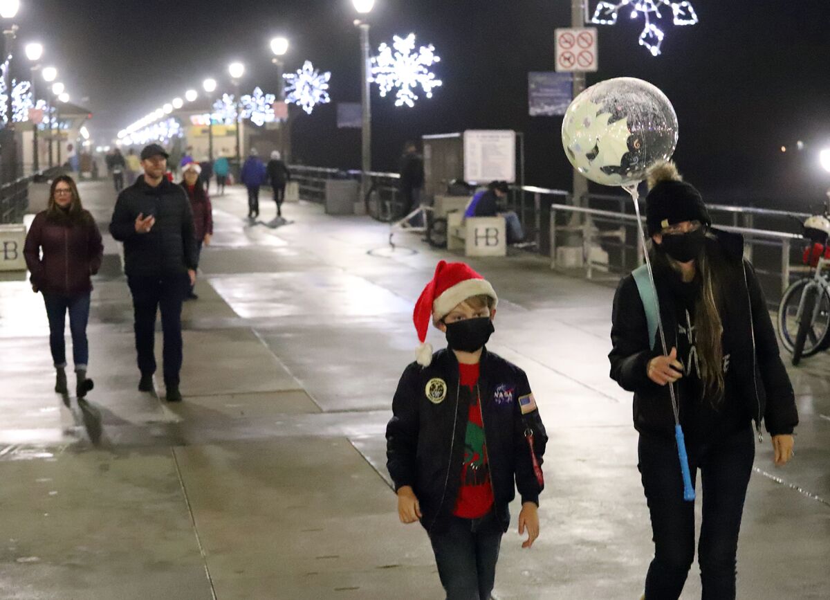 Attendees of Huntington Beach's annual Light A Light of Love ceremony Sunday on the city's pier.