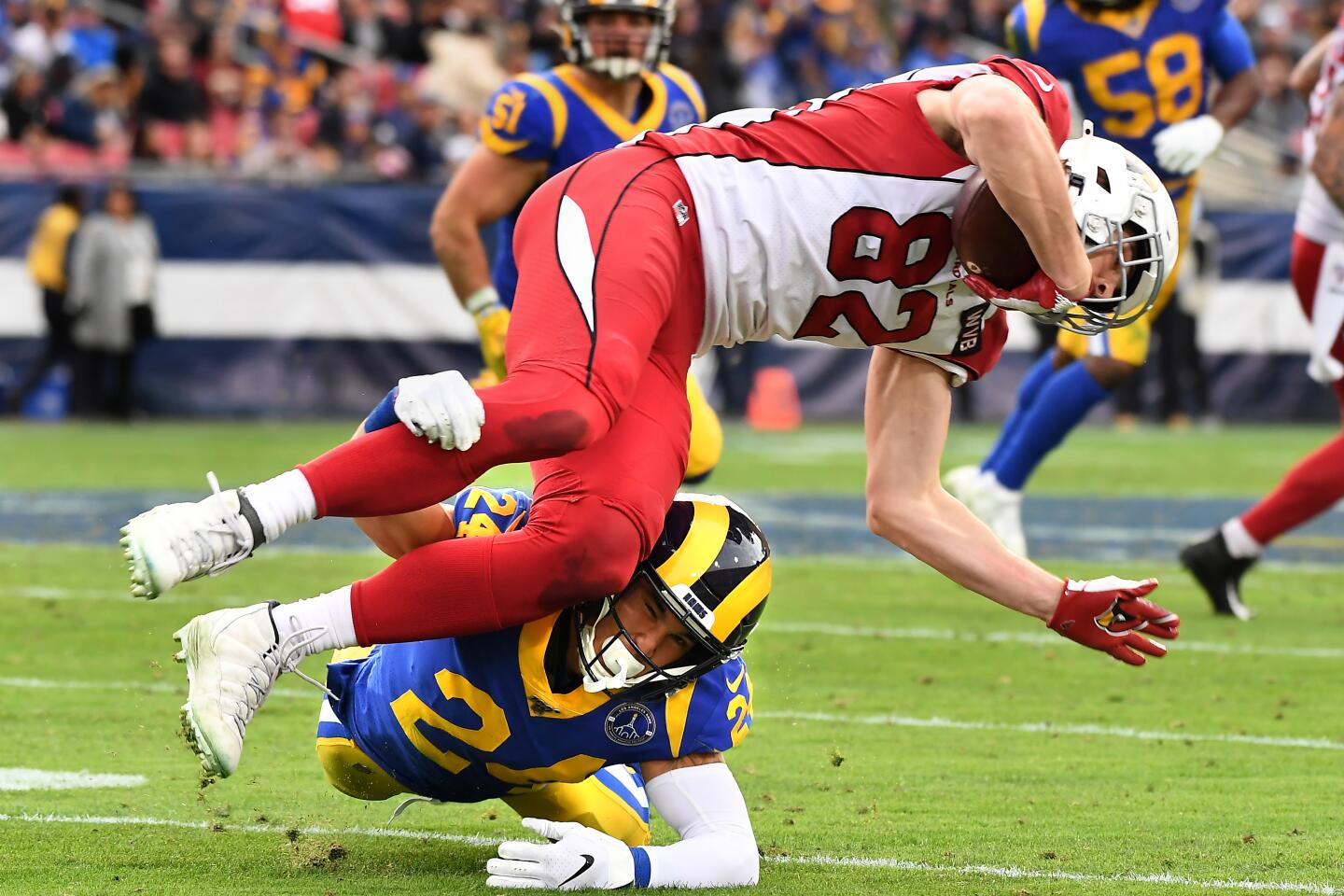 Rams safety Taylor Rapp upends Arizona Cardinals tight end Dan Arnold during the third quarter.