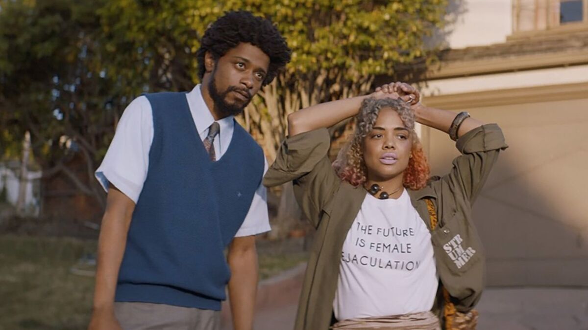 Lakeith Stanfield and Tessa Thompson appear in the film "Sorry to Bother You" from director Boots Riley.
