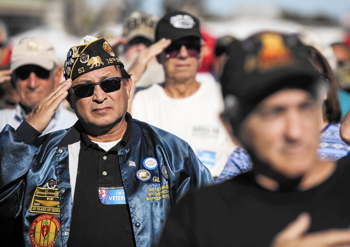 Gil Soto, a U.S. Army veteran, salutes during the 2015 Orange County Veterans Day community celebration on Wednesday at the OC Fairgrounds.