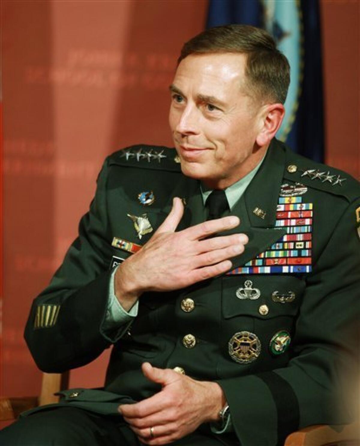 FILE - This is a Tuesday, April 21, 2009 file photo of U.S. Army Gen. David Petraeus, head of U.S. Central Command, touching his hand to his chest after it was suggested that Reserve Officers Training Corps, or ROTC, should return to Harvard University during a forum at the John F. Kennedy School of Government on the schools campus, in Cambridge, Mass. Petraeus, the top U.S. commander for the wars in Iraq and Afghanistan, was diagnosed with prostate cancer in February and has since undergone two months of radiation treatment, the Pentagon said Tuesday. (AP Photo/Steven Senne)