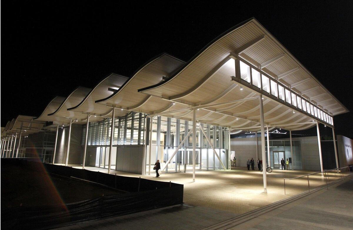 City Hall lights up the darkness in Newport Beach at its new location on Avocado and Farallon.