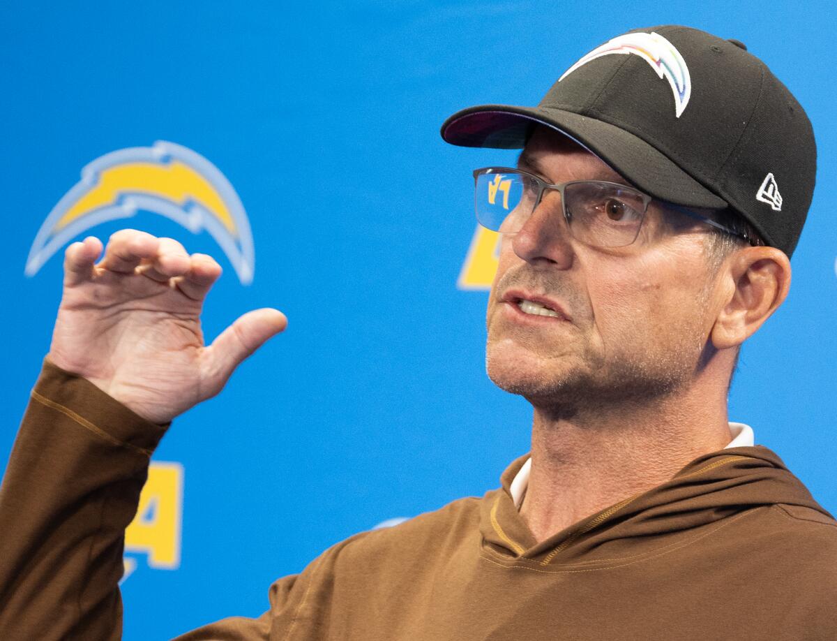 Chargers coach Jim Harbaugh speaks during a press conference at Hoag Performance Center in Costa Mesa.