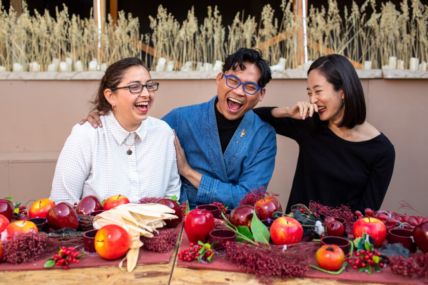 Scenic designers Tanya Orellana, left, and Carlo Maghirang, center with projection designer Hana S. Kim, on the set of “Sweet Land.”
