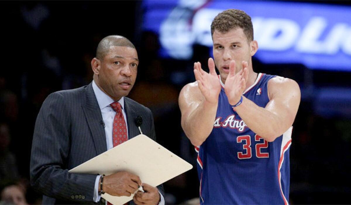 Doc Rivers and Blake Griffin talk during the Clippers' 142-94 rout of the Lakers on Thursday at Staples Center.