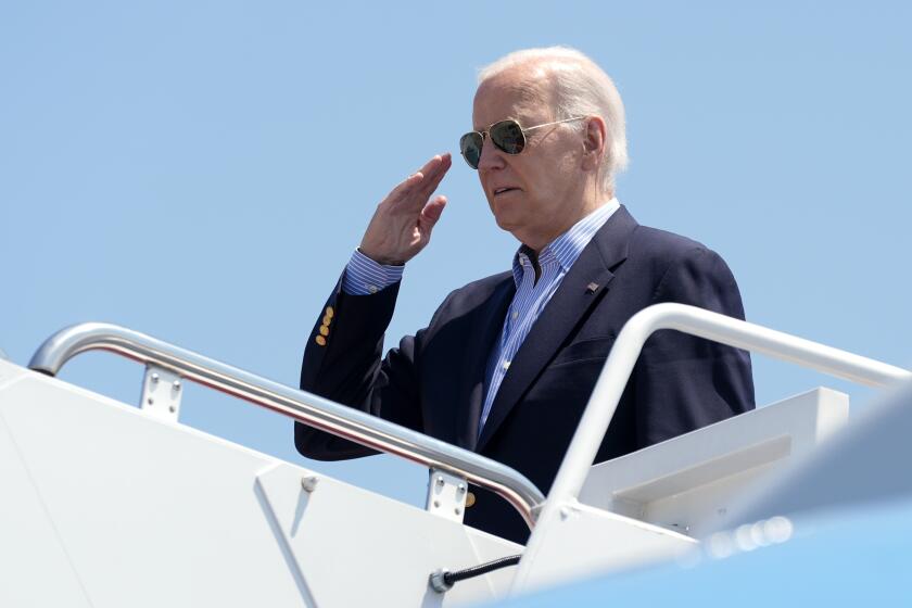 President Joe Biden salutes as he boards Air Force One at Andrews Air Force Base, Md., en route to a campaign trip in Madison, Wis., Friday, July 5, 2024. (AP Photo/Manuel Balce Ceneta)